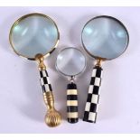 THREE CHESS BOARD MAGNIFYING GLASSES. Largest 22 cm high. (3)