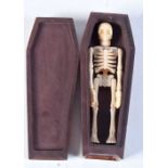 A HARDWOOD AND BONE COFFIN. 11.75 cm x 4.5 cm.