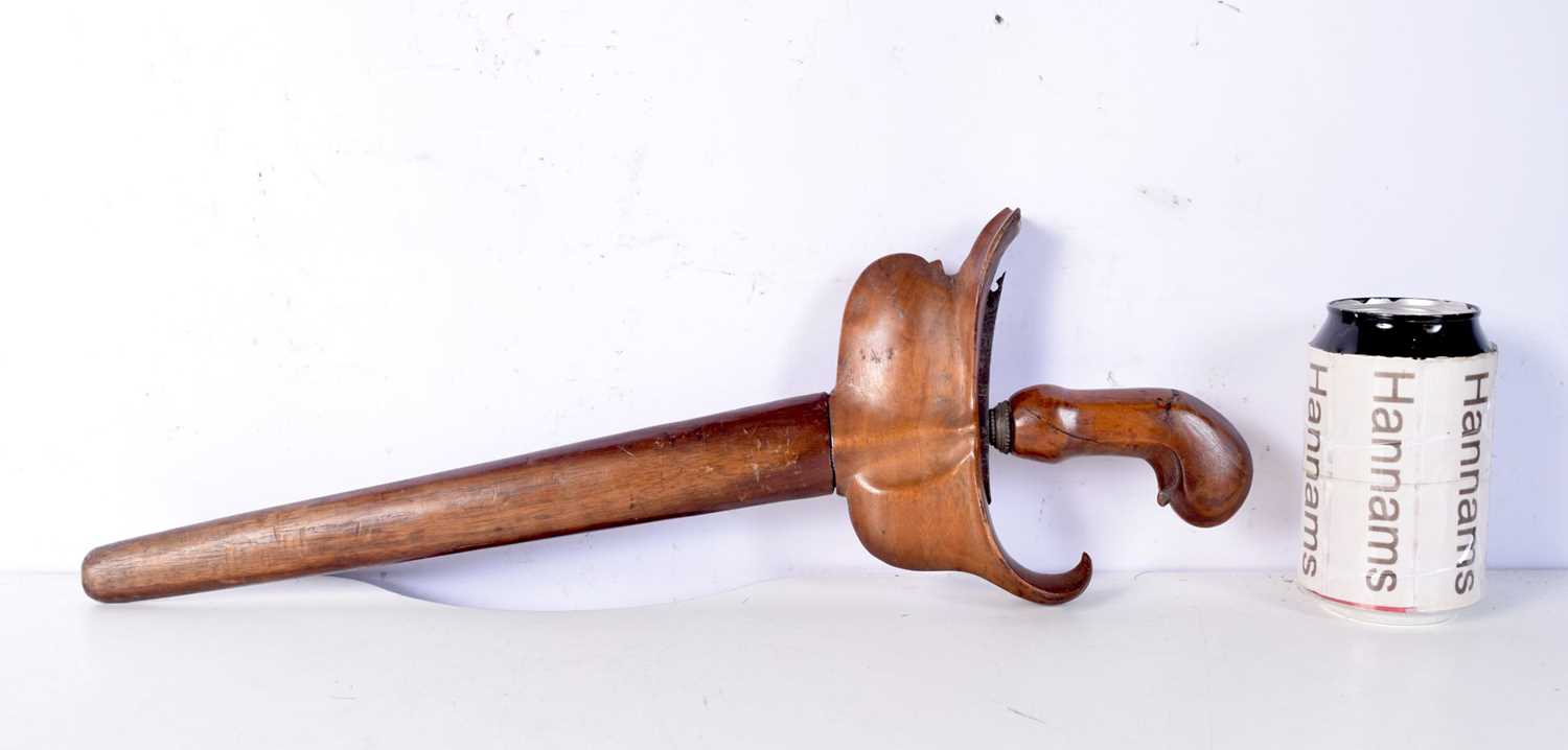 A wooden handled Kris dagger 46 cm.