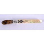 A VICTORIAN TAXIDERMY ANIMAL CLAW AND MOTHER OF PEARL LETTER OPENER. 25 cm long.