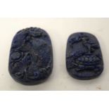 TWO CHINESE LAPIS LAZULI PENDANTS 20th Century. Largest 5 cm x 3 cm. (2)