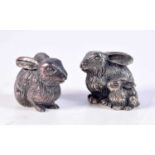 A PAIR OF CONTINENTAL SILVER RABBIT CONDIMENTS. 44.2 grams. 3.5 cm x 3 cm.