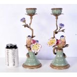 A pair of gilt metal and porcelain bird candlesticks 30 cm. (2).