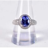 AN 18CT GOLD DIAMOND AND TANZANITE RING. R. 6.6 grams.