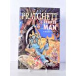 A signed copy of Terry Pratchett "Reaper Man " .