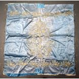 A MIDDLE EASTERN TURKISH SILK BLUE TEXTILE decorated with flowers. 95 cm square.