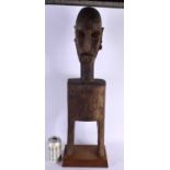 A LARGE EARLY 20TH CENTURY AFRICAN TRIBAL CARVED WOOD PULLEY. 70 cm high.