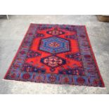 A Persian rug 210 x 160 cm