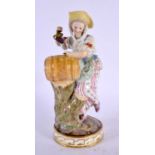 A 19TH CENTURY MEISSEN PORCELAIN FIGURE OF A FEMALE modelled holding grapes beside a barrel. 17 cm