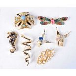 A lovely collection of gilt metal broaches largest 8.5 cm (6).