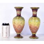 A pair of antique Lambeth Doulton vases with floral decoration 24 cm (2).
