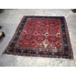 A Persian rug 194 x 165 cm.