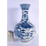 A LARGE 19TH CENTURY CHINESE BLUE AND WHITE PORCELAIN VASE painted with dragons. 40 cm x 20 cm.