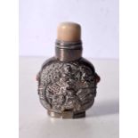 A Chinese white metal embossed snuff bottle 8 cm.