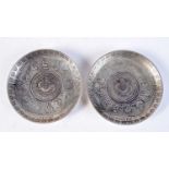 A pair of White metal Chinese coin dishes 9 cm diameter (2).