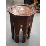 AN ANTIQUE MIDDLE EASTERN MOORISH LIBERTY TYPE TABLE depicting a central mother of pearl star. 40 cm