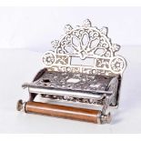 An antique Toilet roll holder 13 x 14 x 10 cm.