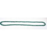 A MALACHITE NECKLACE. 97 grams. 92 cm long.