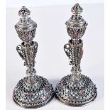 A PAIR OF 19TH CENTURY CONTINENTAL SILVER ENAMEL RUBY AND TURQUOISE CANDLESTICKS with reversible