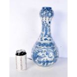 A Chinese blue and white porcelain garlic neck shaped vase, decorated with figures in gardens. 39
