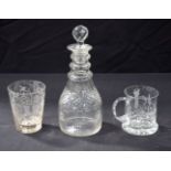 A GLASS DECANTER AND TWO GLASSES. (3)