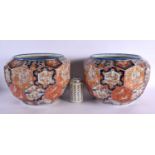 A LARGE PAIR OF 19TH CENTURY JAPANESE MEIJI PERIOD FACETTED JARDINIERES painted with figures in