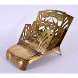 AN ART NOUVEAU BRASS DESK STAND. 16 cm x 14 cm.