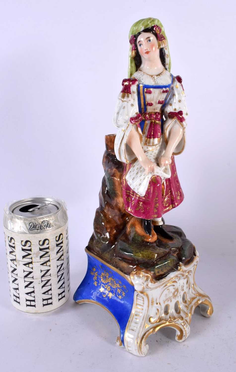A LARGE 19TH CENTURY FRENCH PARIS PORCELAIN FIGURE OF A FEMALE modelled upon a naturalistic base. 32