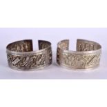 A PAIR OF 19TH CENTURY CHINESE EXPORT SILVER CUFF BANGLES Qing. 80 grams. 7 cm wide.