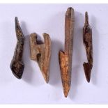 FOUR ANTIQUE NORTH AMERICAN PETRIFIED FOSSILISED BONE HARPOON HEADS. Largest 8 cm long. (4)