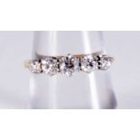 AN ANTIQUE PLATINUM FIVE STONE DIAMOND RING. 2.5 grams. O.