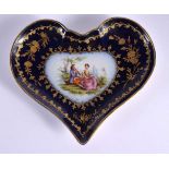 AN ANTIQUE CONTINENTAL SEVRES STYLE HEART SHAPED PORCELAIN DISH painted with lovers. 15 cm x 12 cm.