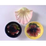 TWO MOORCROFT HIBISCUS BOWLS C1936 to 1953 and a Worcester shell pin tray No 1904. Largest 8 cm