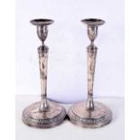 A PAIR OF ANTIQUE CONTINENTAL SILVER CANDLESTICKS. 1531 grams overall. 27 cm high.
