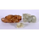 THREE CHINESE CARVED JADE BEASTS 20th Century. Largest 11 cm wide. (3)