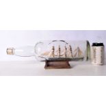 A vintage sailing ship in a bottle 15x43cm.