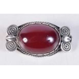 A VINTAGE CHERRY AMBER TYPE SILVER BROOCH. 5 cm x 3 cm.