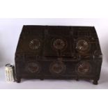 A 19TH CENTURY WESTERN INDIAN CARVED WOOD DOWRY BOX with pitched top and hinged lid, decorated