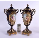 A LARGE PAIR OF 19TH CENTURY FRENCH SEVRES PORCELAIN VASES AND COVERS painted with lovers in