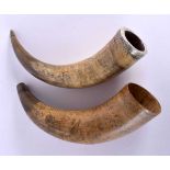 A PAIR OF EARLY 19TH CENTURY CARVED SCRIMSHAW HORN FLASKS decorated all over with buildings and