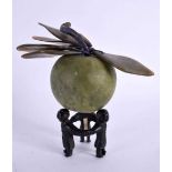 A CHINESE CARVED JADE FRUIT upon a figural bronze base. 12 cm x 12 cm.