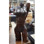 A LARGE CARVED SCULPTURE OF A FEMALE TORSO. 72 cm x 22 cm.