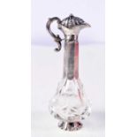 AN ANTIQUE SILVER JUG FORM CRYSTAL GLASS SCENT BOTTLE. 64 grams. 10.5 cm high.