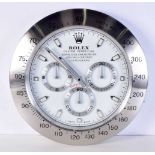 A Contemporary Rolex dealership style wall clock 34 cm.