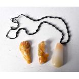 A collection of carved hardstone pendants 6cm (3)