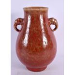 A CHINESE TWIN HANDLED RED GLAZED VASE 20th Century. 20 cm high.