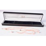 AN ART DECO SILVER AND CORAL GARNITURE. Necklace 39 cm long. (4)