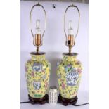 A PAIR OF CHINESE FAMILLE JAUNE PORCELAIN LAMPS 20th Century. 62 cm high.