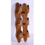 A PAIR OF EDWARDIAN TAXIDERMY RIFLE WALL HOLDERS formed as animals hooves. 47 cm long.