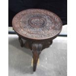 A carved Anglo Indian carved hardwood elephant side table 46 X 46 cm .